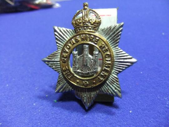 The devonshire regiment army military cap badge